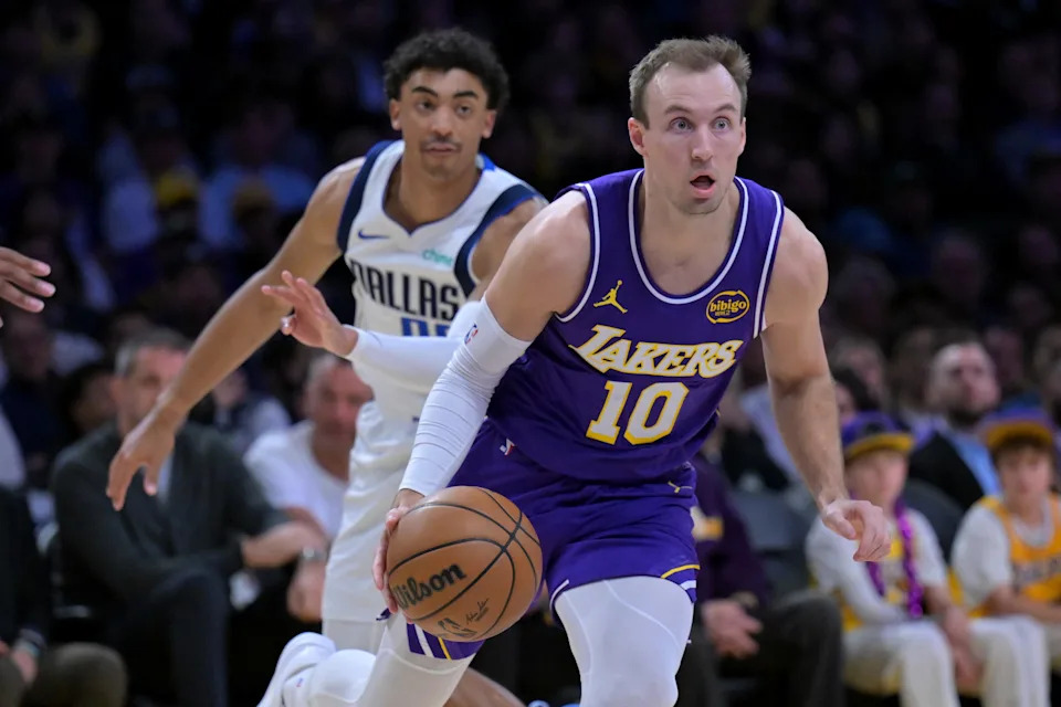 Feb 12, 2026; Los Angeles, California, USA; Los Angeles Lakers guard Luke Kennard (10) drives past Dallas Mavericks guard Max Christie (00) in the first half at Crypto.com Arena. Mandatory Credit: Jayne Kamin-Oncea-Imagn Images