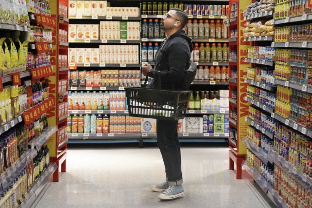 A customer shops in a new small format No Frills grocery store that the grocery chain is testing, in Toronto, Thursday, May 30, 2024. THE CANADIAN PRESS/Chris Young