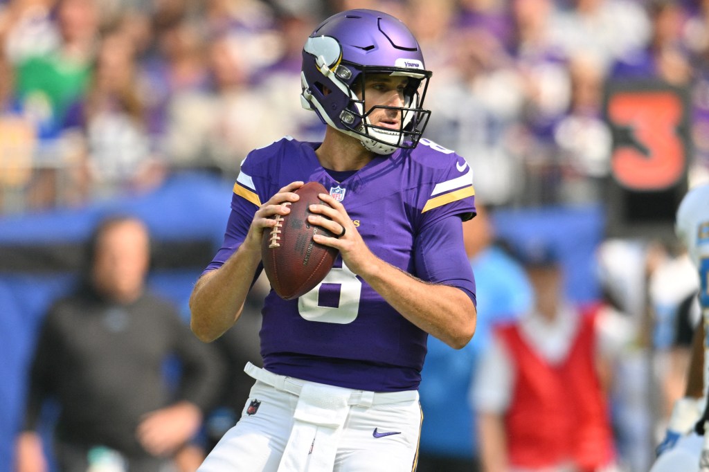 Minnesota Vikings quarterback Kirk Cousins (8) looking to throw a pass.