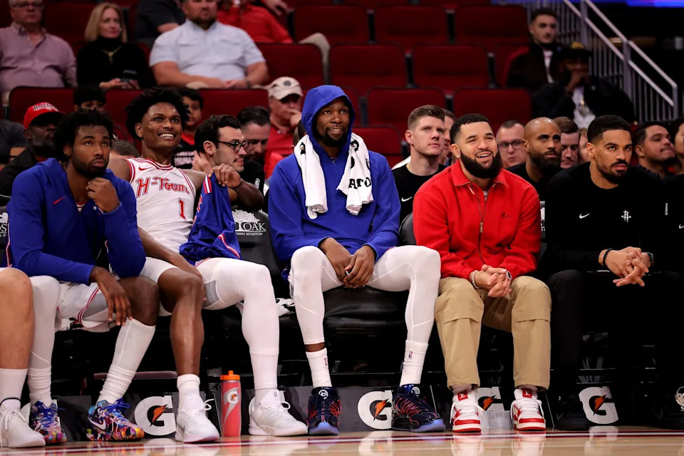 Nov 12, 2025; Houston, Texas, USA; (from L-to-R) Houston Rockets forward Tari Eason (17), guard Amen Thompson (1), forward Kevin Durant (7) and guard Fred VanVleet (5, red) on the bench against the Washington Wizards during the fourth quarter at Toyota Center. Mandatory Credit: Erik Williams-Imagn Images