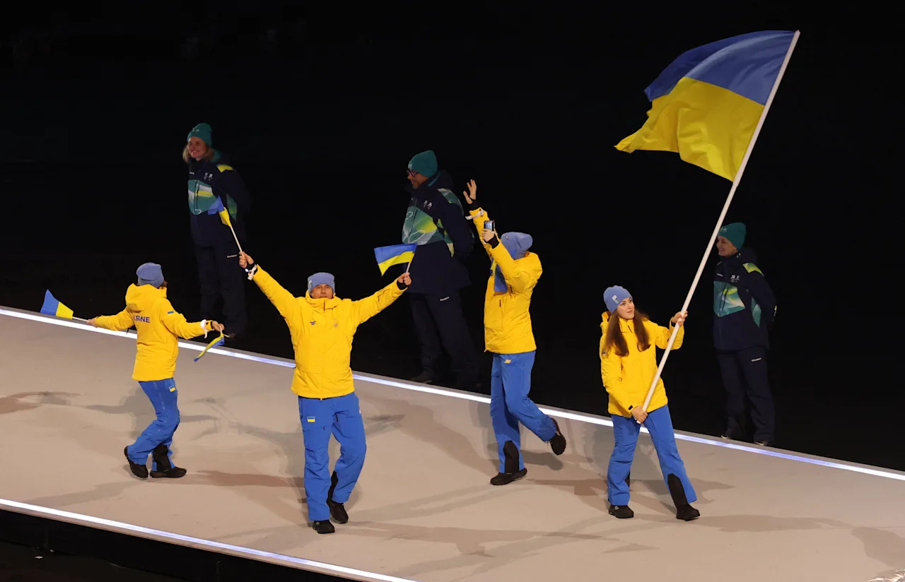 Flagbearer Yelyzaveta Sydorko of Ukraine in the athletes parade during the opening ceremony.