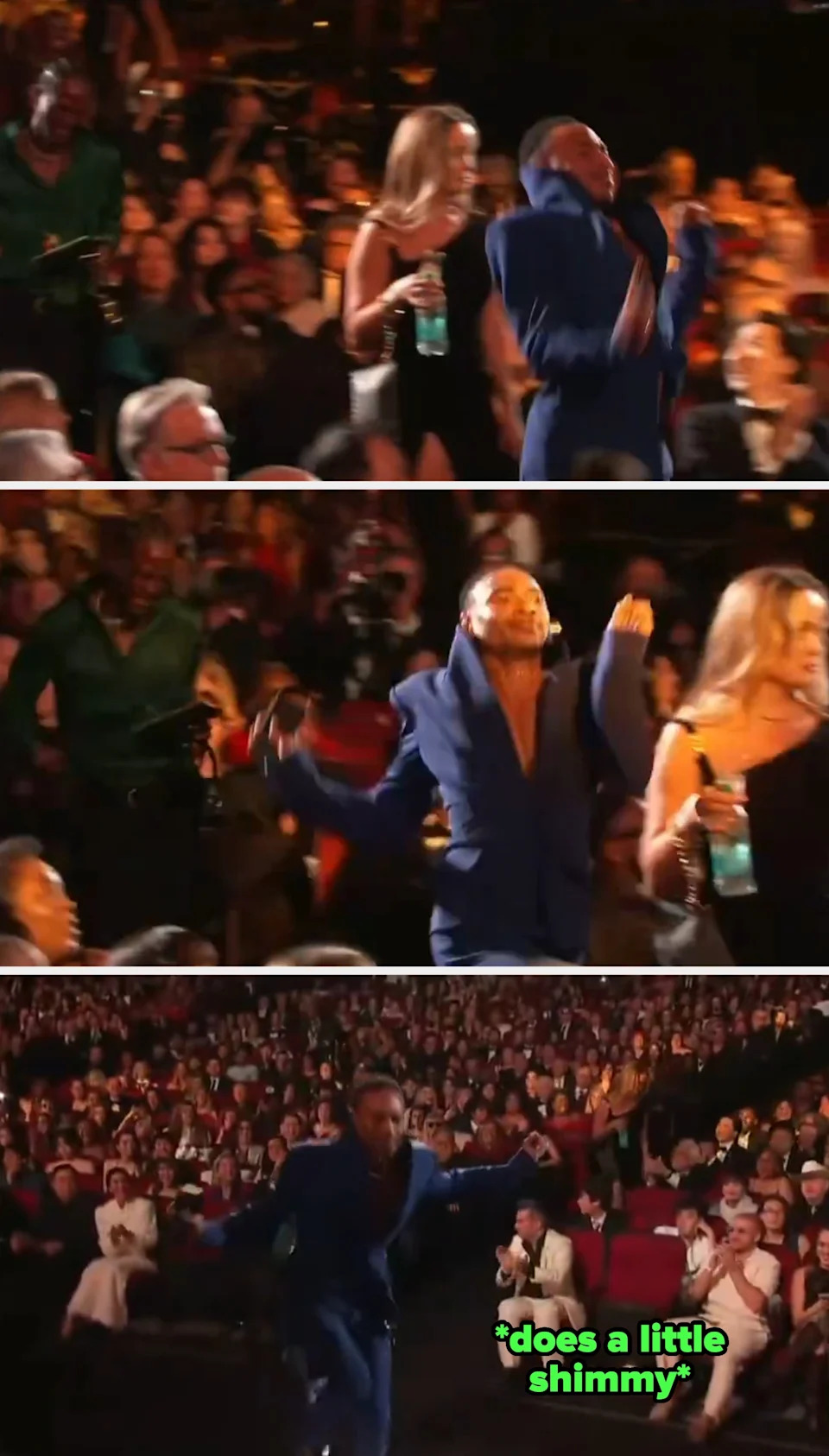 Person in a blue suit enthusiastically moves through a crowded event audience, with people seated around watching