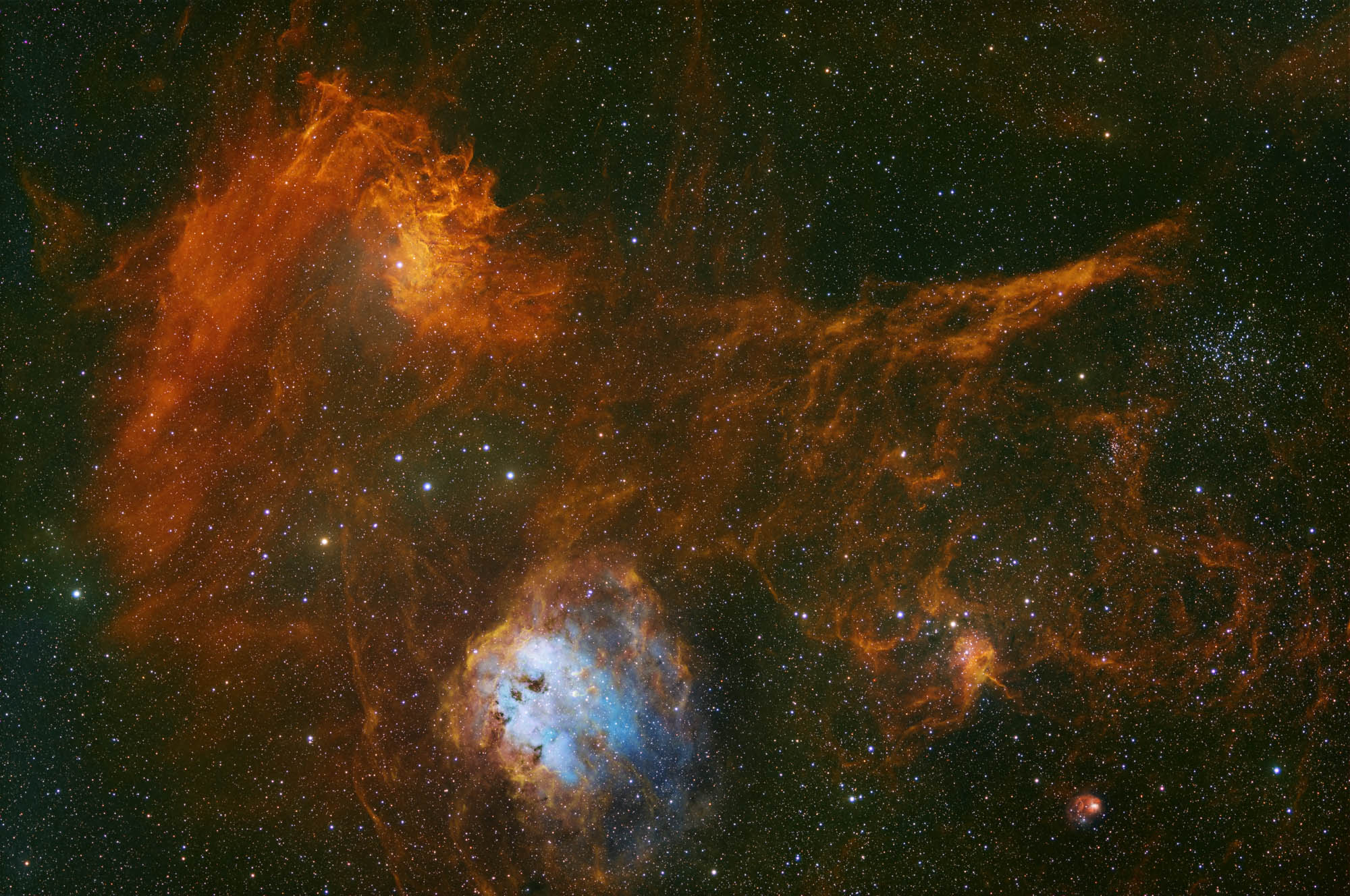 Swirls of red and orange gas fill a deep space starry background with a glowing ball of blue light at the bottom of the image.