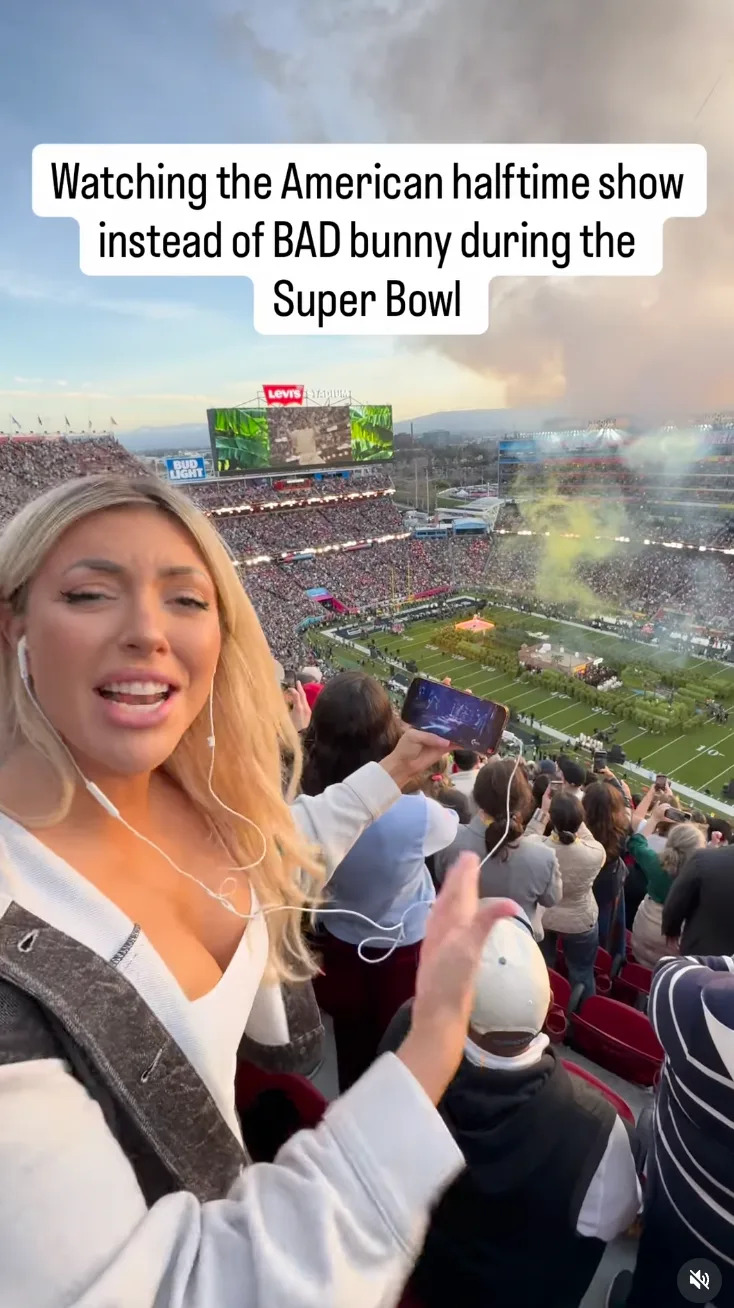 Person in a stadium reacts to halftime show. Crowd and field visible, with phones recording the event. Text mentions preferring the show to an artist