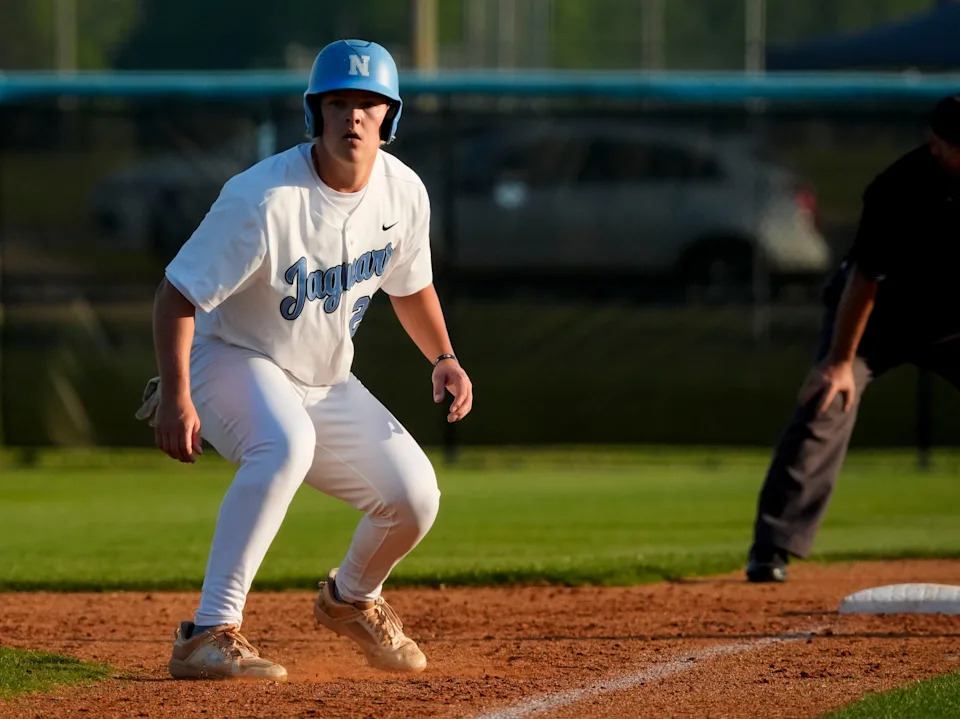 Apr 18, 2025; Tuscaloosa, AL, USA; Northridge's Evan Malone (23) takes a lead from third against Helena in the first round of the high school baseball playoffs at Northridge High.