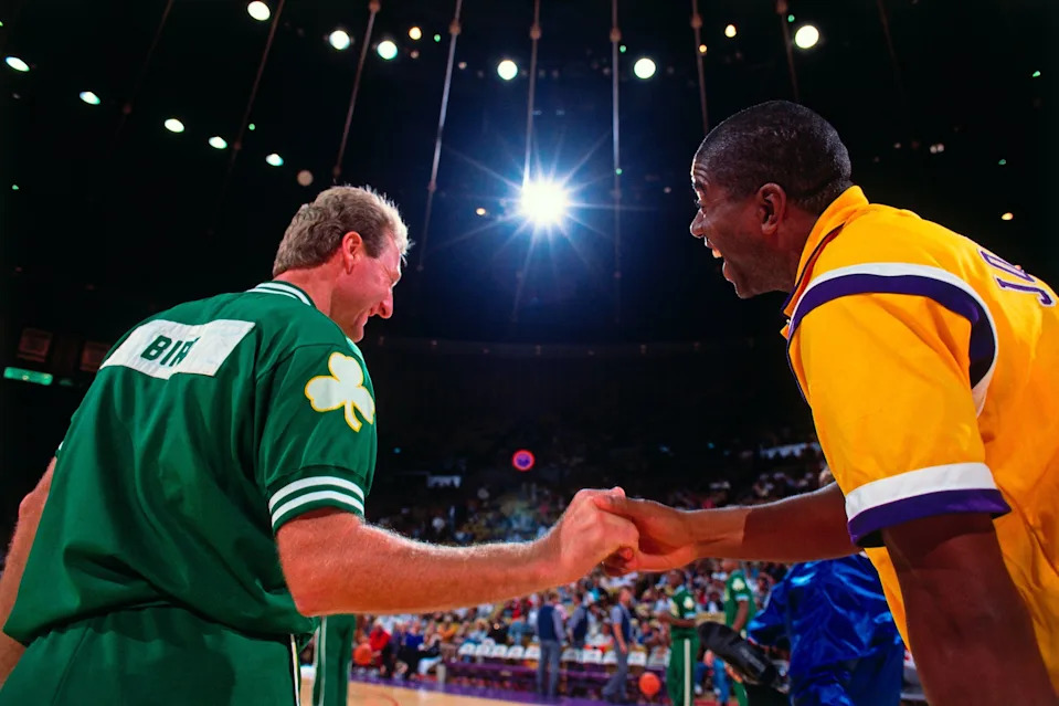 INGLEWOOD, CA - 1991: Magic Johnson #32 of the Los Angeles Lakers greets Larry Bird #33 of the Boston Celtics prior to the games during the 1991 NBA season at The Great Western Forum in Inglewood, California. NOTE TO USER: User expressly acknowledges and agrees that, by downloading and/or using this Photograph, user is consenting to the terms and conditions of the Getty Images License Agreement. Mandatory Copyright Notice: Copyright 1991 NBAE (Photo by Andrew D. Bernstein/NBAE via Getty Images)