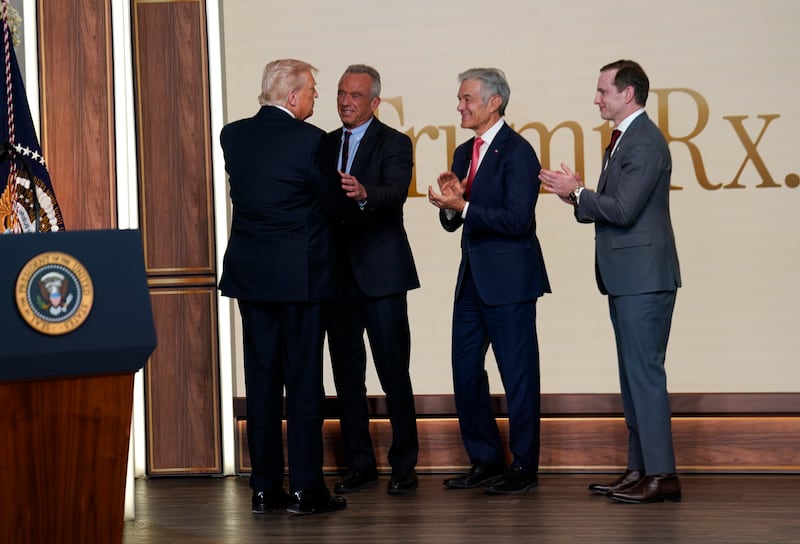 U.S. President Donald Trump, U.S. Secretary of Health and Human Services Robert F. Kennedy Jr., Administrator for the Centers for Medicare & Medicaid Services Mehmet Oz and Chief Design Officer of the National Design Studio Joe Gebbia talk during an event on drug pricing in the South Court Auditorium on the White House campus on February 5, 2026 in Washington, DC.