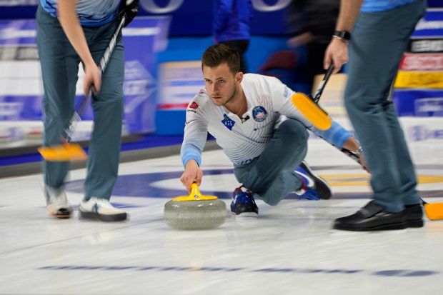 United States skip Korey Dropkin delivers a stone against Scotland during the World Men's Curling Championships, Tuesday, April 5, 2022, in Las Vegas. (AP Photo/John Locher)