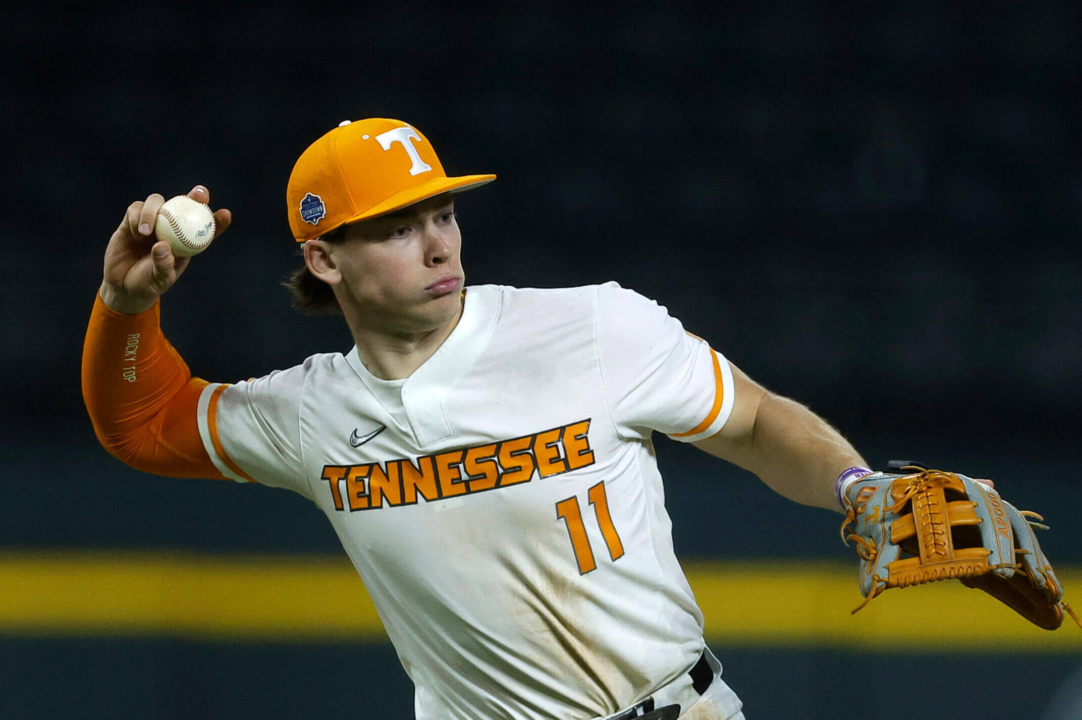 Tennessee infielder Billy Amick, wearing No. 11 on his jersey, throws during a game.