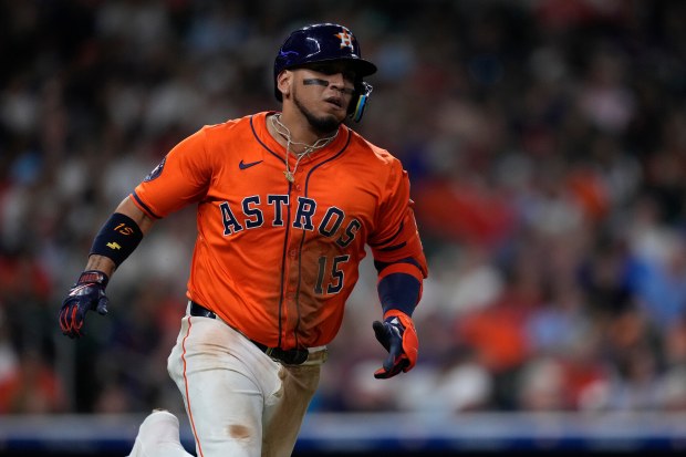 FILE - Houston Astros' Isaac Paredes runs to first after hitting a single during the seventh inning of a baseball game against the Texas Rangers, Friday, July 11, 2025, in Houston. (AP Photo/Kevin M. Cox, File)