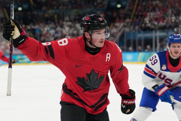 Canada's Cale Makar (8) celebrates after scoring during a men's ice hockey gold medal game between Canada and the United States at the 2026 Winter Olympics, in Milan, Italy, Sunday, Feb. 22, 2026. (AP Photo/Hassan Ammar)