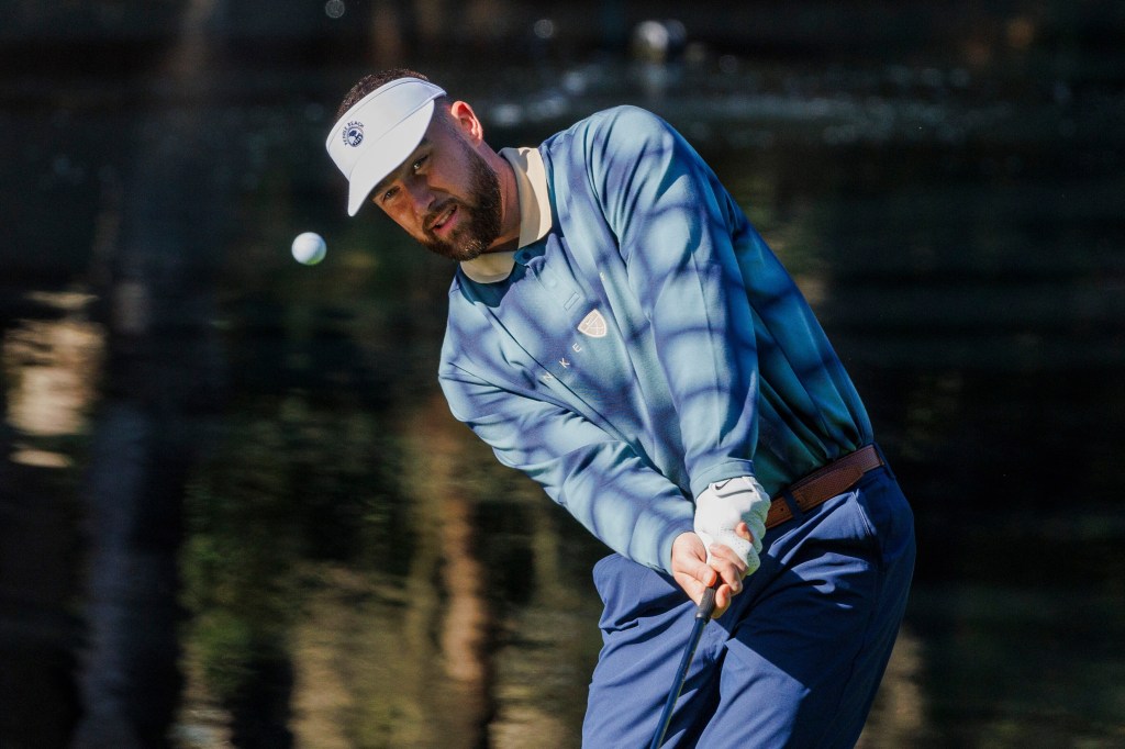 Travis Kelce hitting a golf ball.