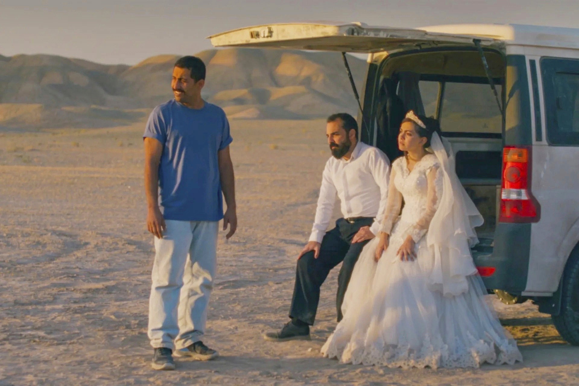 This image released by Neon shows, from left, Mohamad Ali Elyasmehr as Hamid, Majid Panahi as Ali, Hadis Pakbaten as Goli, in a scene from 