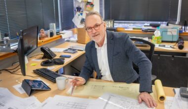 Architect Mark Asher at work in January at his office in Jenkintown. He designs homes at the Jersey Shore and in the Philadelphia suburbs.