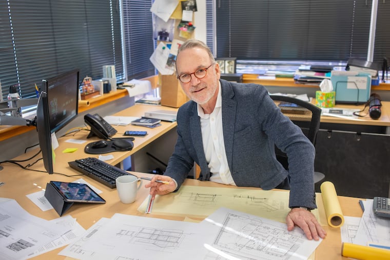 Architect Mark Asher at work in January at his office in Jenkintown. He designs homes at the Jersey Shore and in the Philadelphia suburbs.