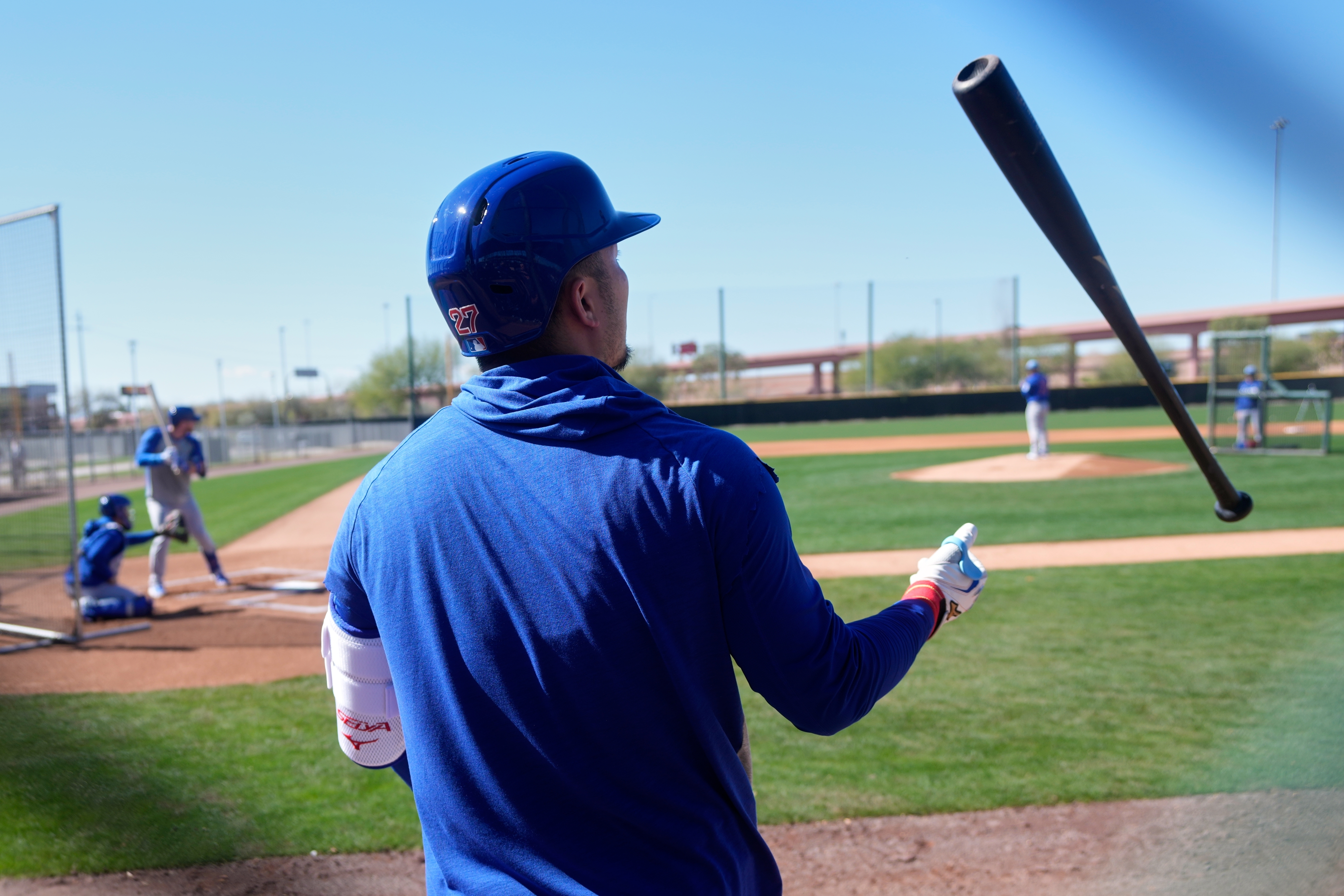 Cubs right fielder Seiya Suzuki flips his bat during a...