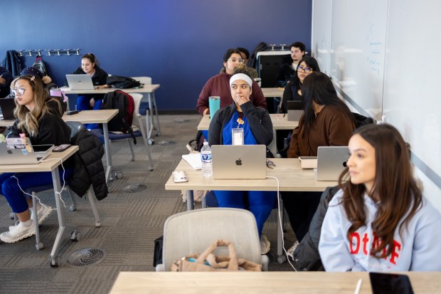 Students listen to Marisol Lagunas teach a first-year pathophysiology class at Chamberlain University, Feb. 4, 2026, in Chicago. Adtalem Global Education is changing its name to Covista, which has five health care-focused institutions, including Chamberlain University. (Josh Boland/Chicago Tribune)