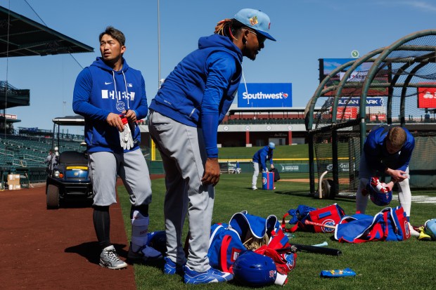 Cubs outfielders Seiya Suzuki, Kevin Alcántara, and Pete Crow-Armstrong prepare for live batting practice during spring training at Sloan Park on Feb. 19, 2026, in Mesa, Ariz. (Armando L. Sanchez/Chicago Tribune)