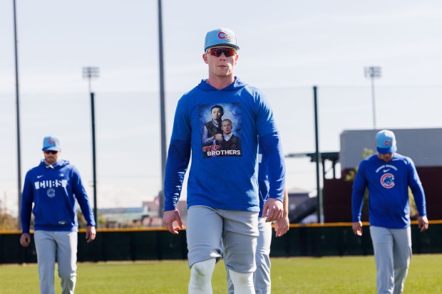 Cubs center fielder Pete Crow-Armstrong wears a shirt with a photo of himself and Seiya Suzuki during warmups at spring training at Sloan Park on Feb. 19, 2026, in Mesa, Ariz. (Armando L. Sanchez/Chicago Tribune)