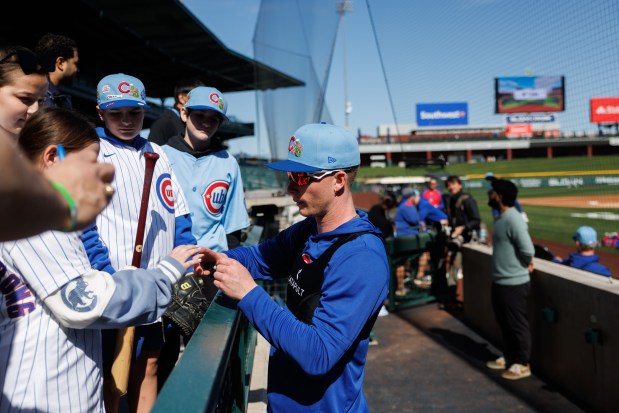 Cubs center fielder Pete Crow-Armstrong signs autographs before live batting practice during spring training at Sloan Park on Feb. 19, 2026, in Mesa, Ariz. (Armando L. Sanchez/Chicago Tribune)
