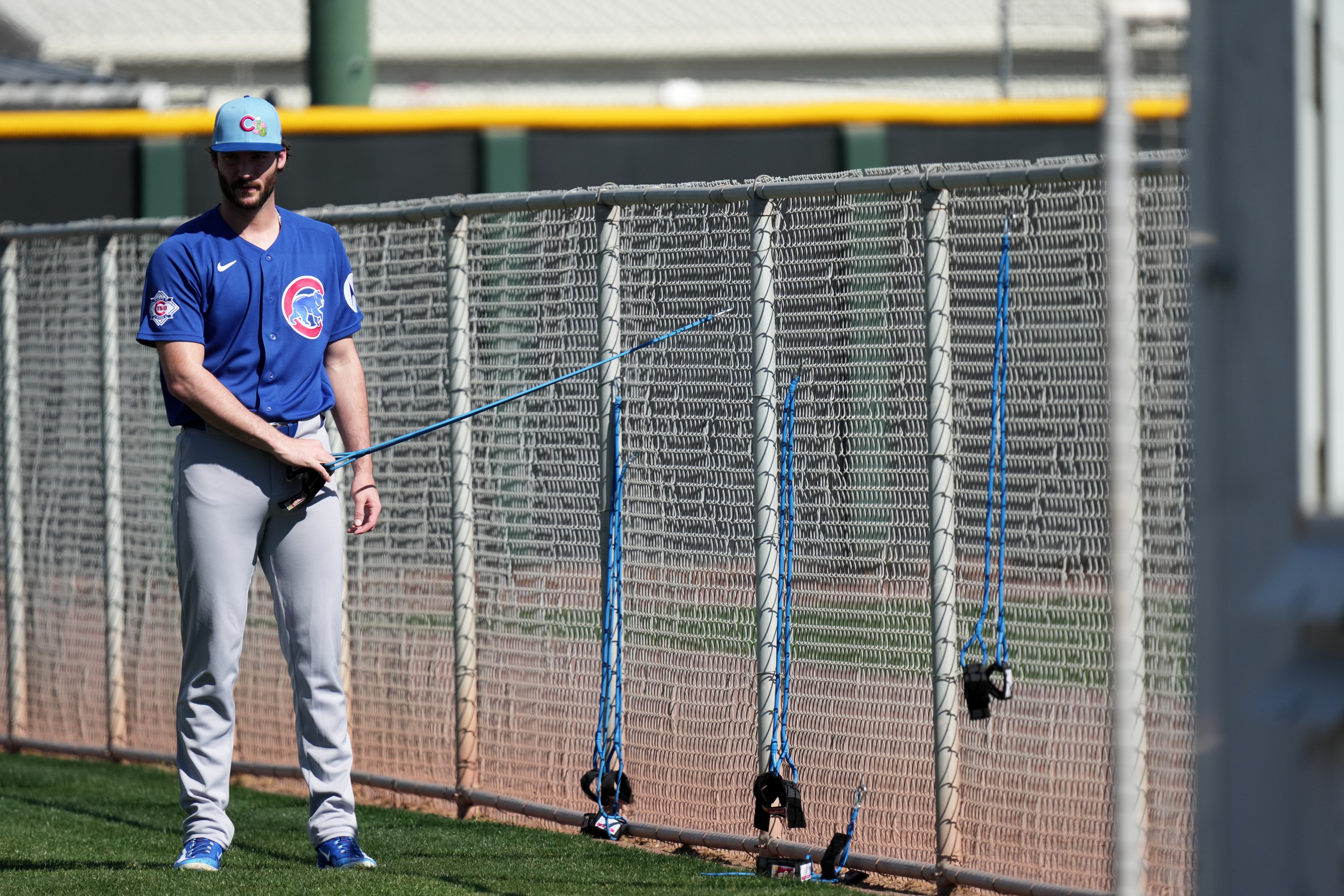 Cubs reliever Jack Neely stretches during a spring training workout...