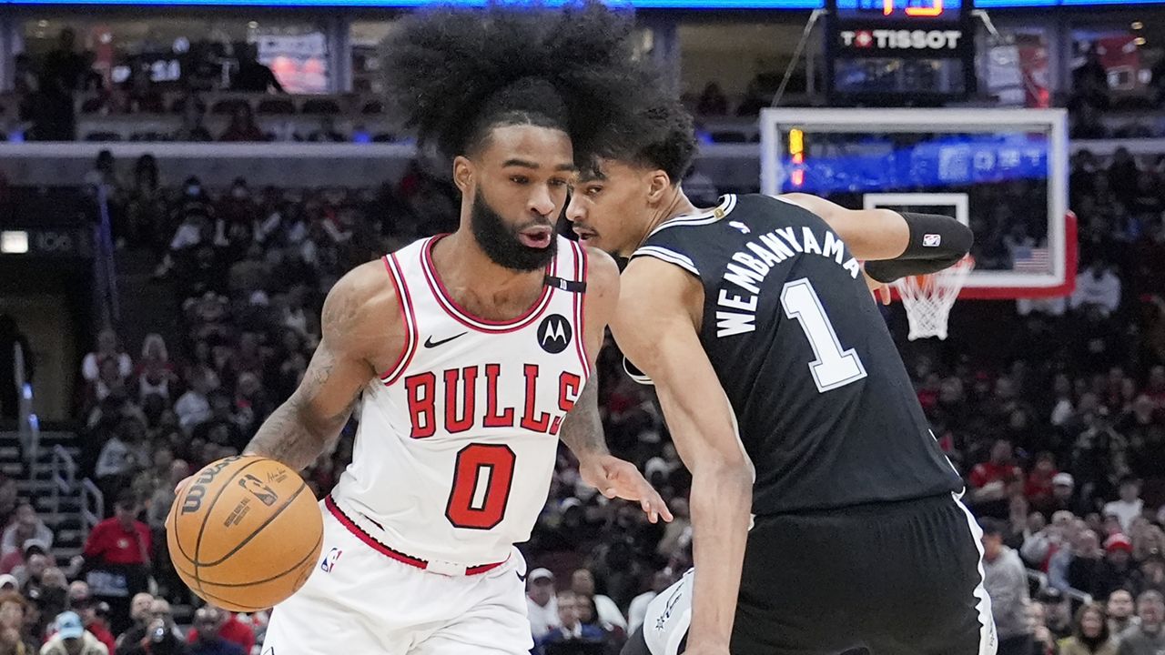 Chicago Bulls guard Coby White, left, drives to the basket past San Antonio Spurs center Victor Wembanyama, right, in Chicago, Monday, Jan. 6, 2025. (AP File Photo/Nam Y. Huh)