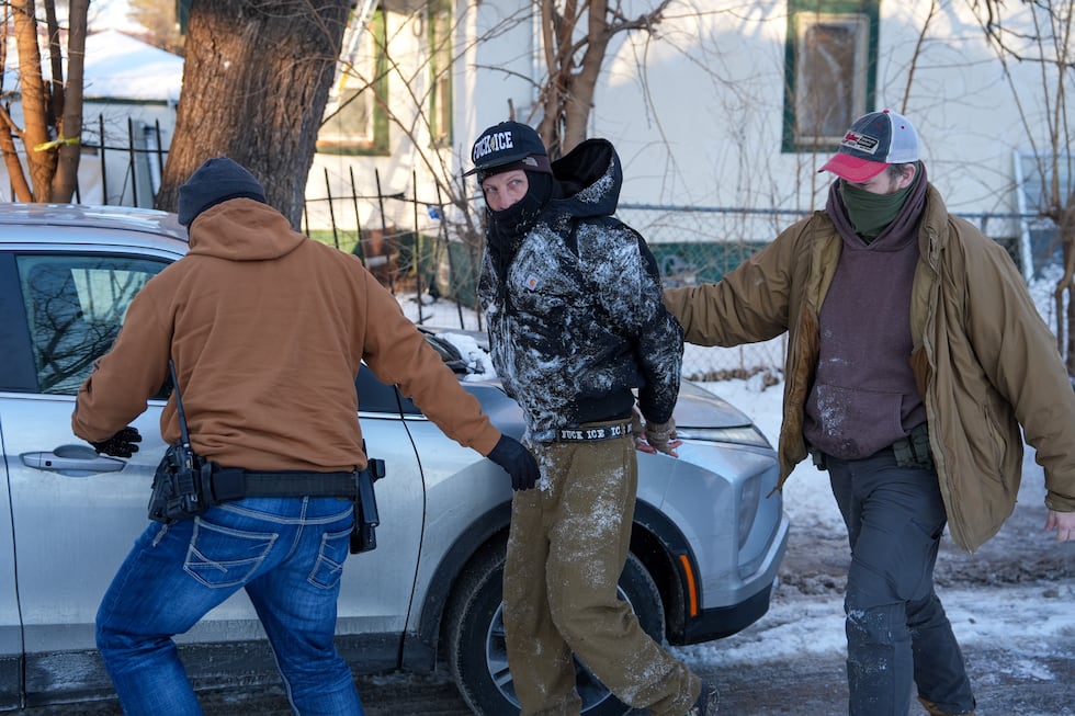 An activist is detained by federal agents on Tuesday, Feb. 3, 2026, in Minneapolis.