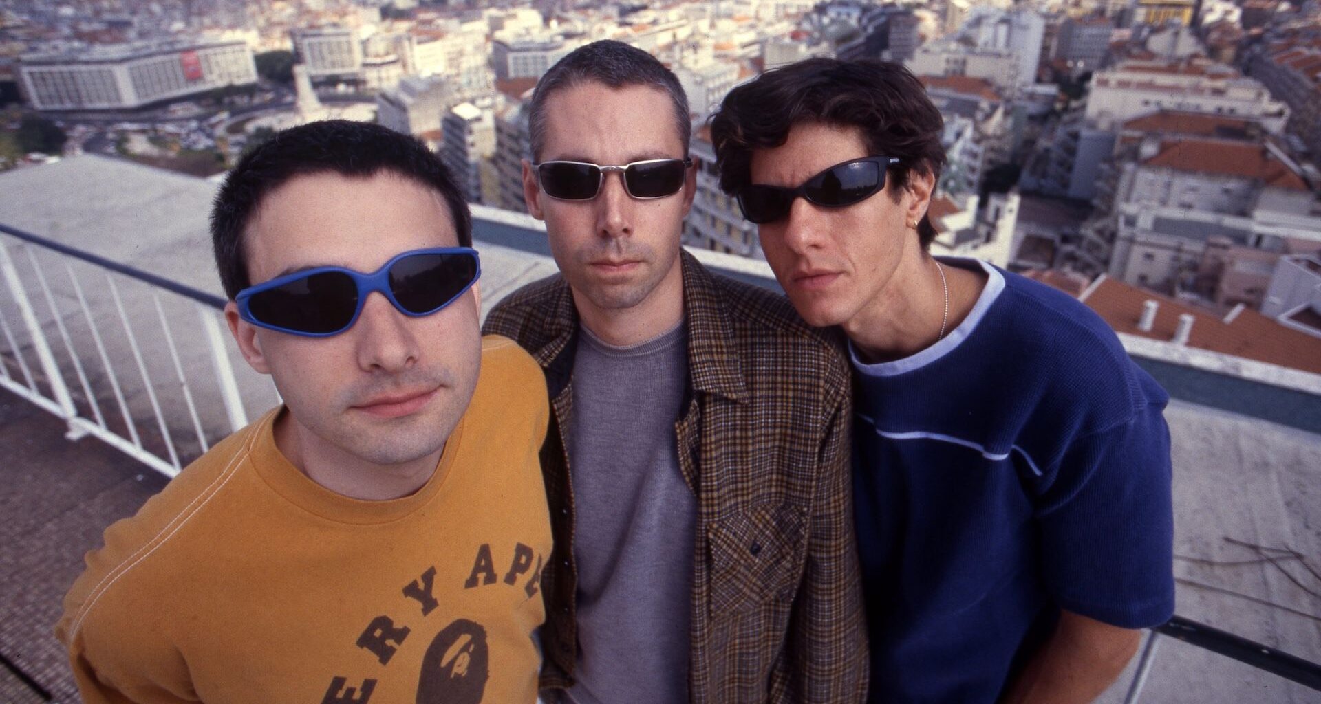 A group portrait of Beastie Boys in Portugal circa 1998