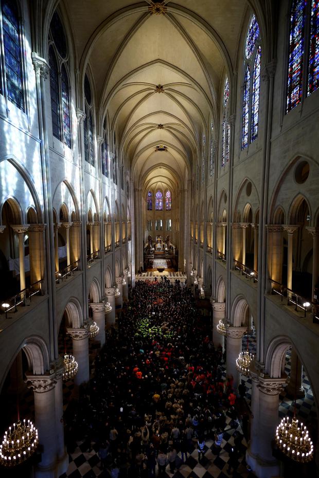 French President Emmanuel Macron delivers a speech to construction workers inside the Notre-Dame de Paris cathedral after visiting the restored interiors on Nov. 29, 2024, in Paris. (Sarah Meyssonnier/Pool via AP)