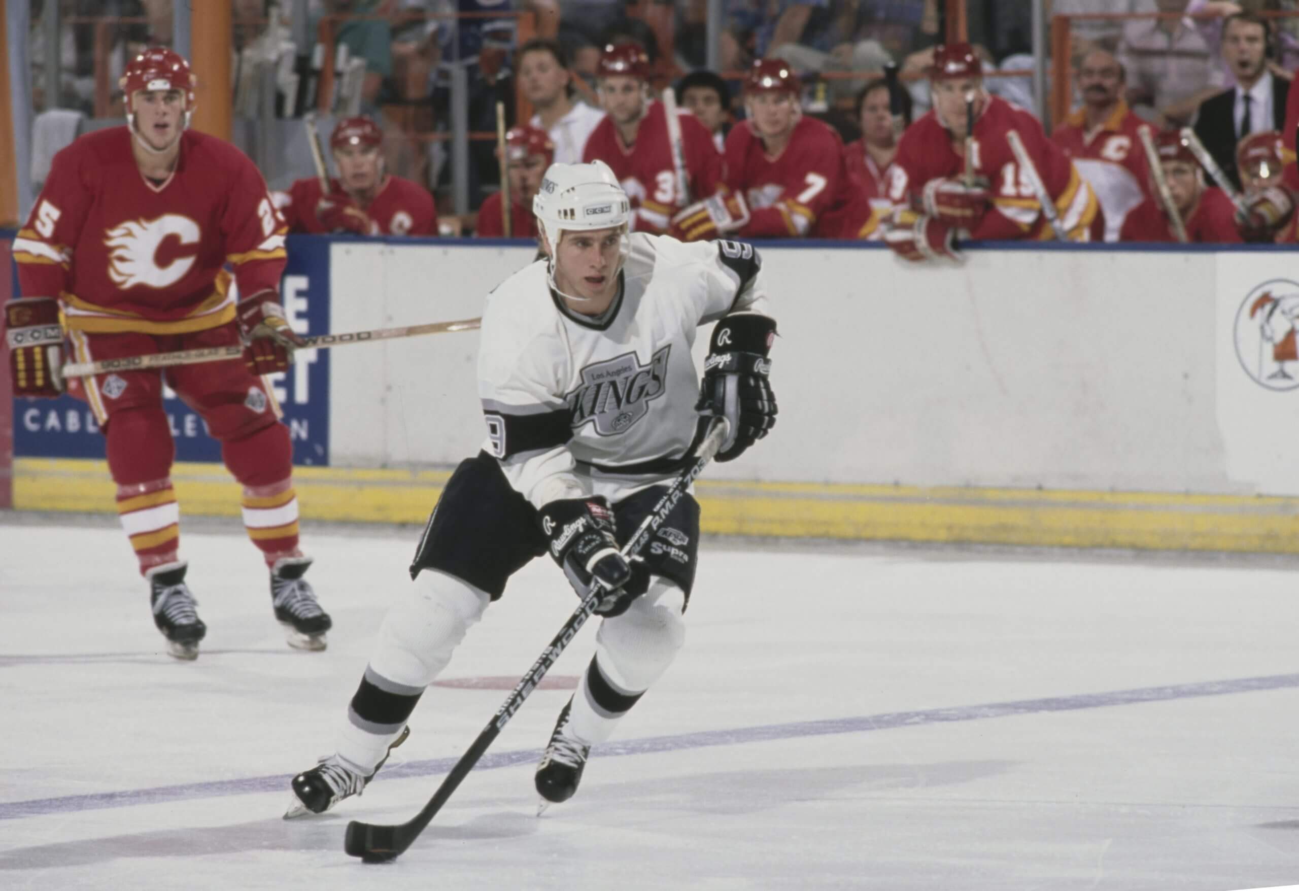 Bernie Nicholls skates with the puck against the Calgary Flames.