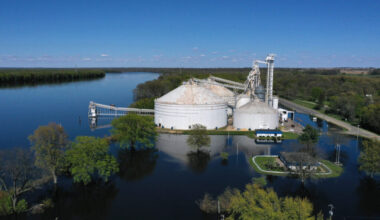 A grain elevator is surrounded by floodwater from the Mississippi River on the Iowa-Illinois border in 2023. Credit: Scott Olson/Getty Images
