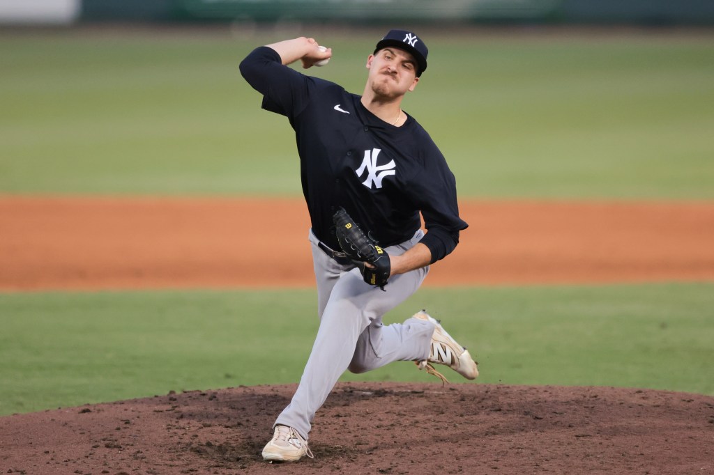Ben Hess #73 of the New York Yankees pitches during the game between the New York Yankees and the Baltimore Orioles at Ed Smith Stadium on Saturday, March 15, 2025 in Sarasota, Florida.