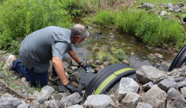 Water quality expert Bob Bowcock tests a creek for cancer-causing PFAS “forever chemicals” at a property in Dalton, Ga., on June 12, 2025. Credit: Issam Ahmed/AFP via Getty Images