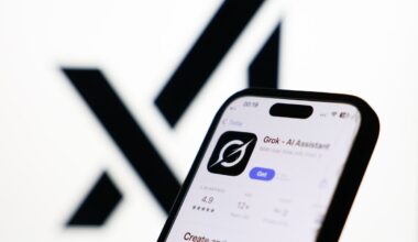 xAI logo displayed on a screen and Grok on App Store displayed on a phone screen