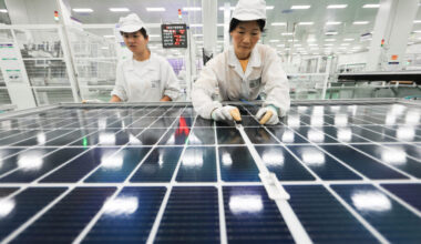 Employees work on photovoltaic cell modules used in solar panels at a factory in Lianyungang, China. Credit: AFP via Getty Images