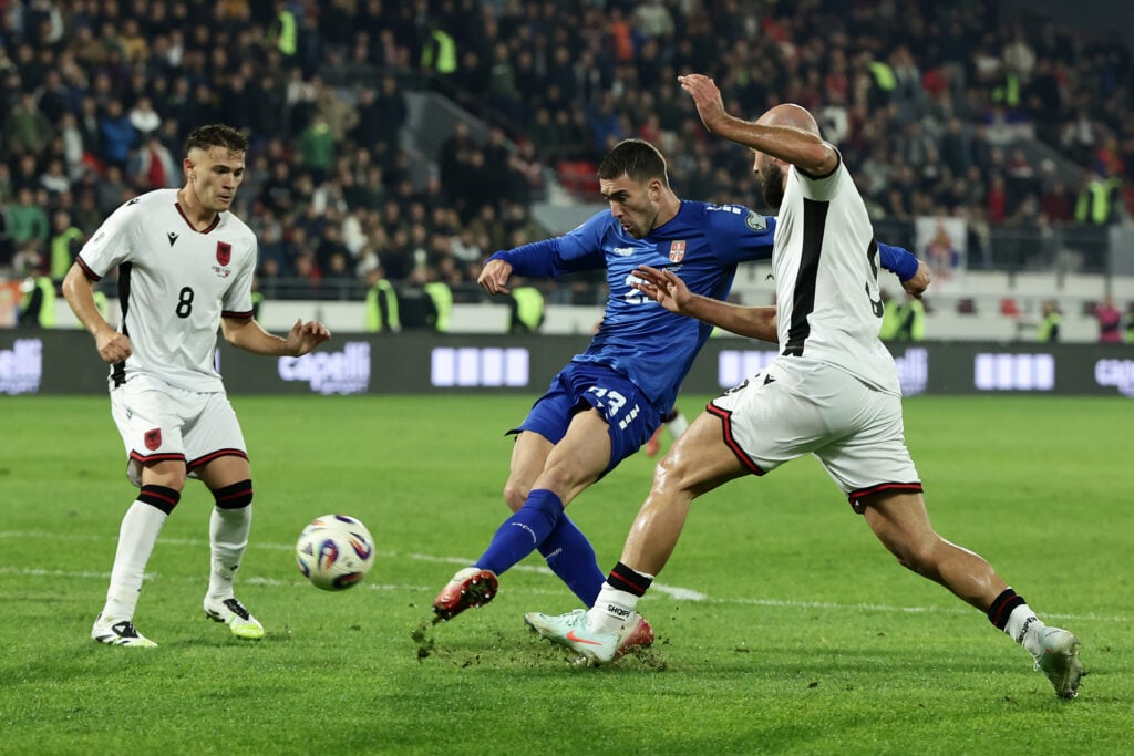 Dusan Vlahovic of Serbia shoots whilst under pressure