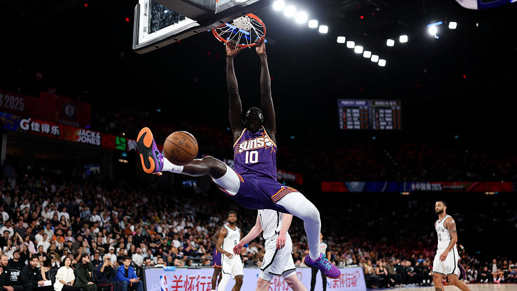 Khaman Maluach #10 of Phoenix Suns dunks the ball during the NBA China Games 2025 between Brooklyn ...
