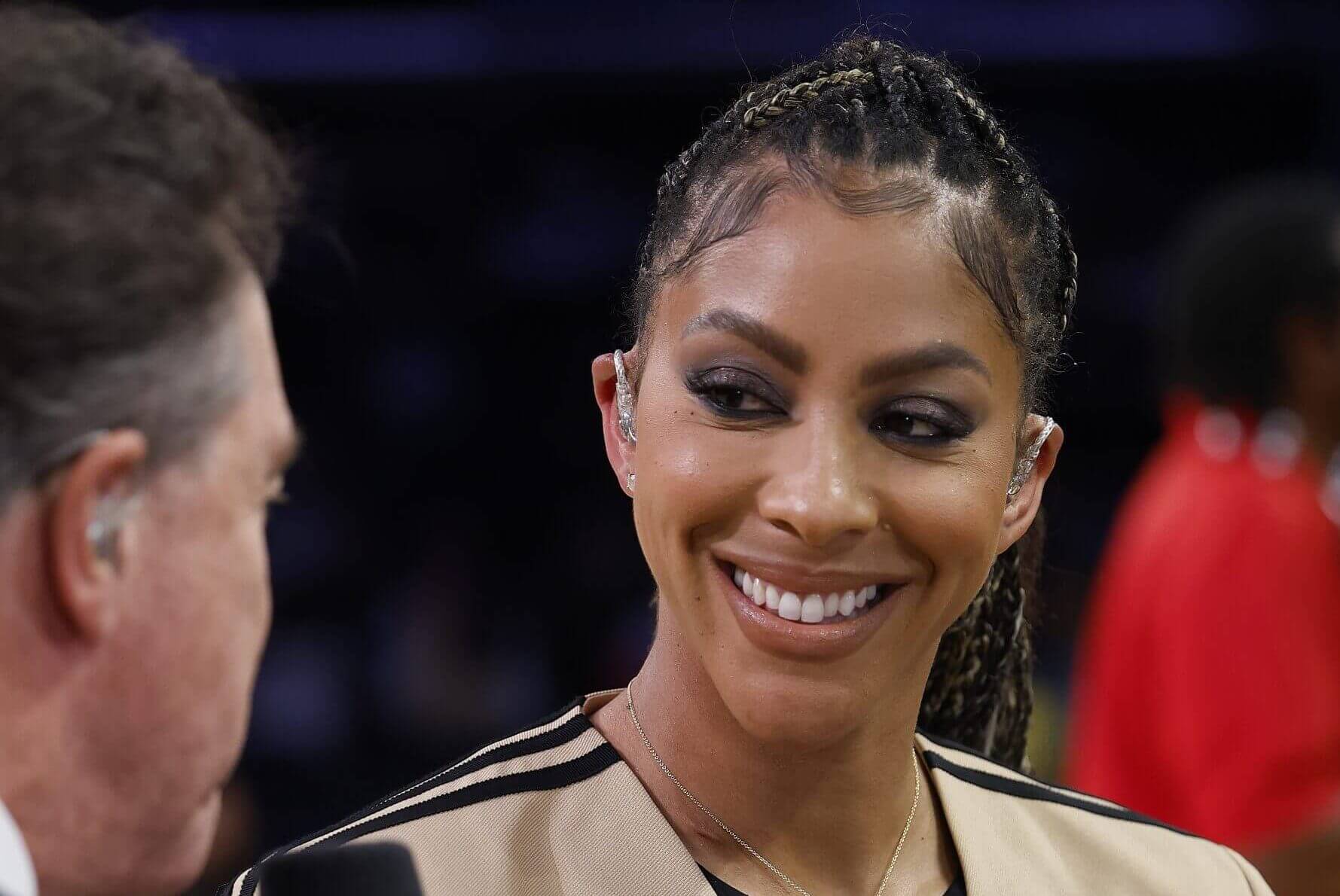 Close-up of Candace Parker smiling during a Prime video broadcast before an NBA game.
