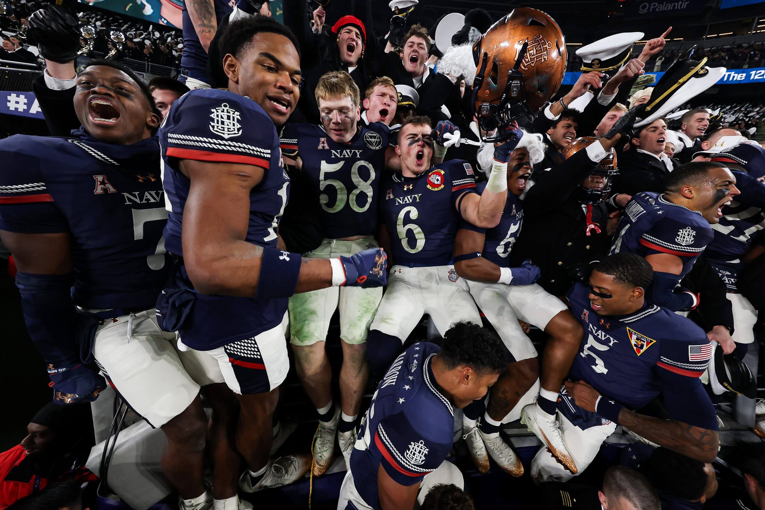 The Navy Midshipmen celebrate after winning the 126th Army-Navy game.