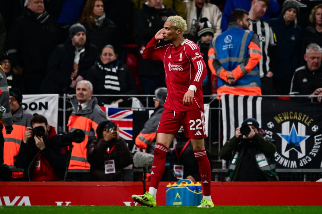 Hugo Ekitike cups his ear towards the Newcastle United fans after scoring against them for Liverpool at Anfield in the Premier League.