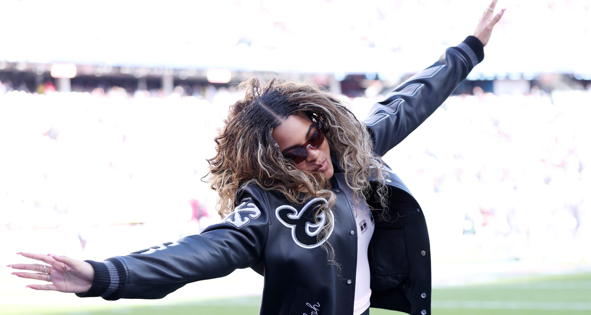 Blue Ivy Carter jumps on the field