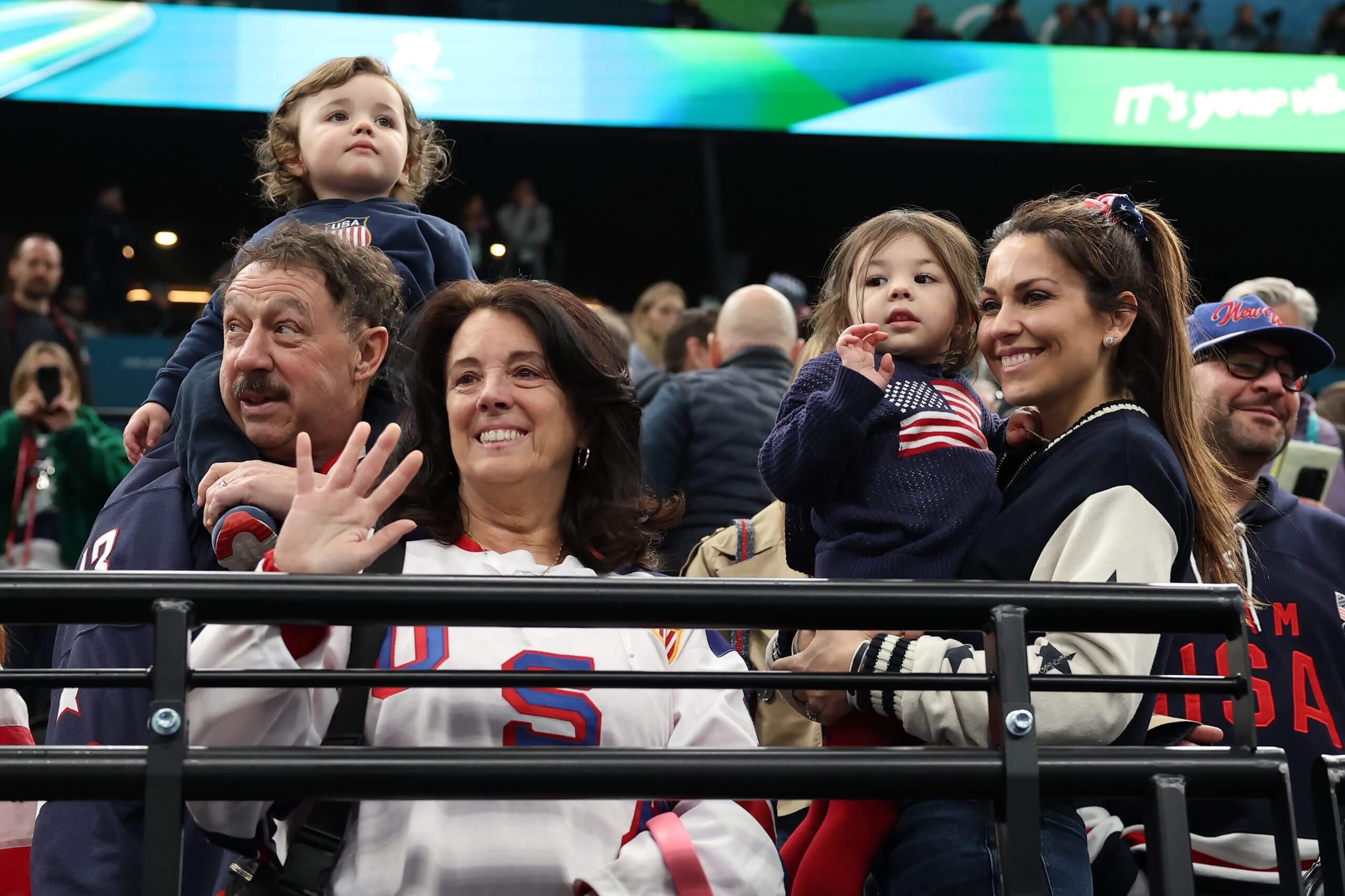 Johnny Gaudreau's parents, wife and two children wave from the crowd.