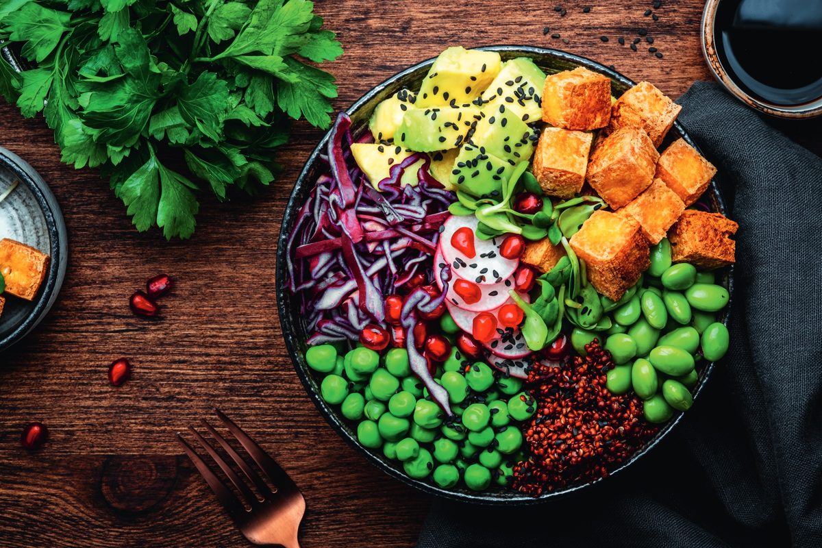 A large bowl of salad on a wooden table