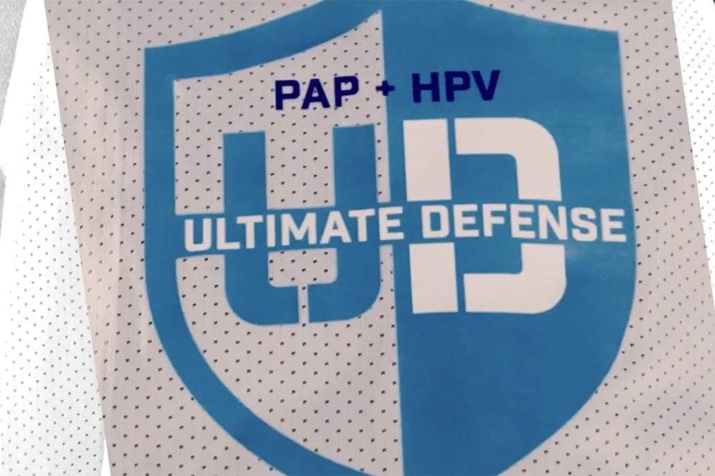 "Ultimate Defense" campaign logo on a basketball jersey