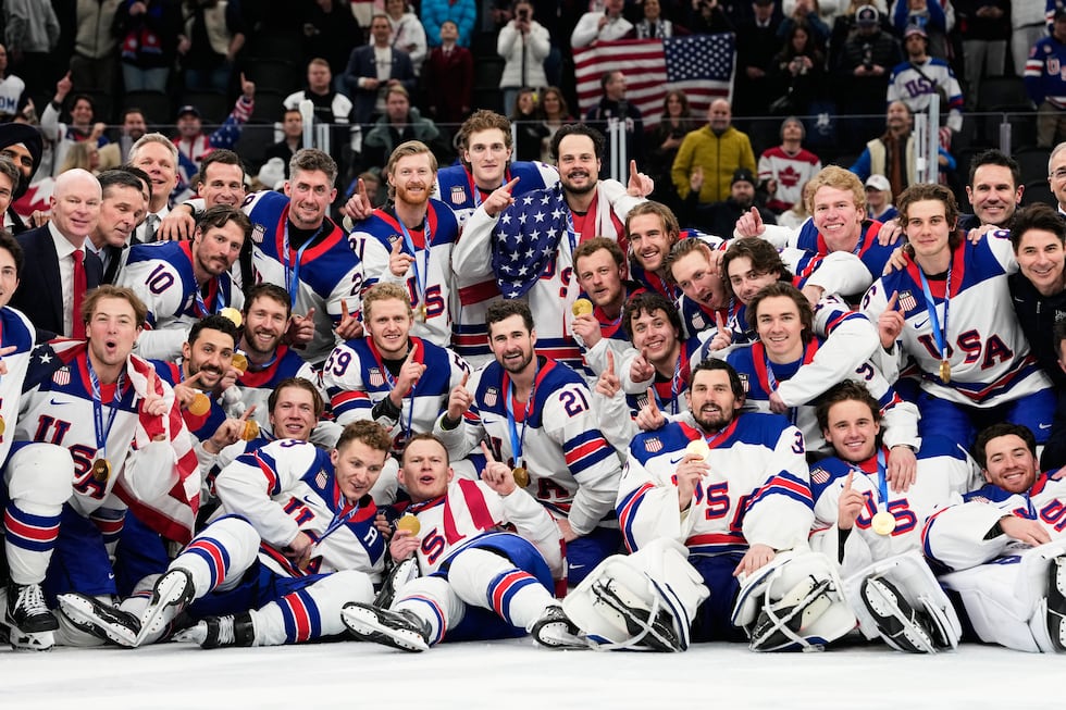 Gold medalists of the United States pose after the men's ice hockey gold medal game between...