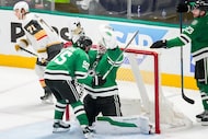 Dallas Stars goaltender Jake Oettinger (29) celebrates with center Matt Duchene (95) time...