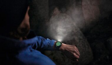A person with a smartwatch emitting an LED light beam