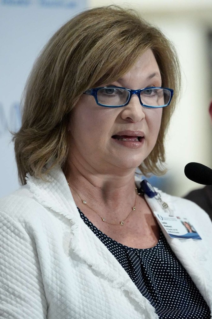 Dr. LouAnn Woodward speaking at a press conference at UMMC
