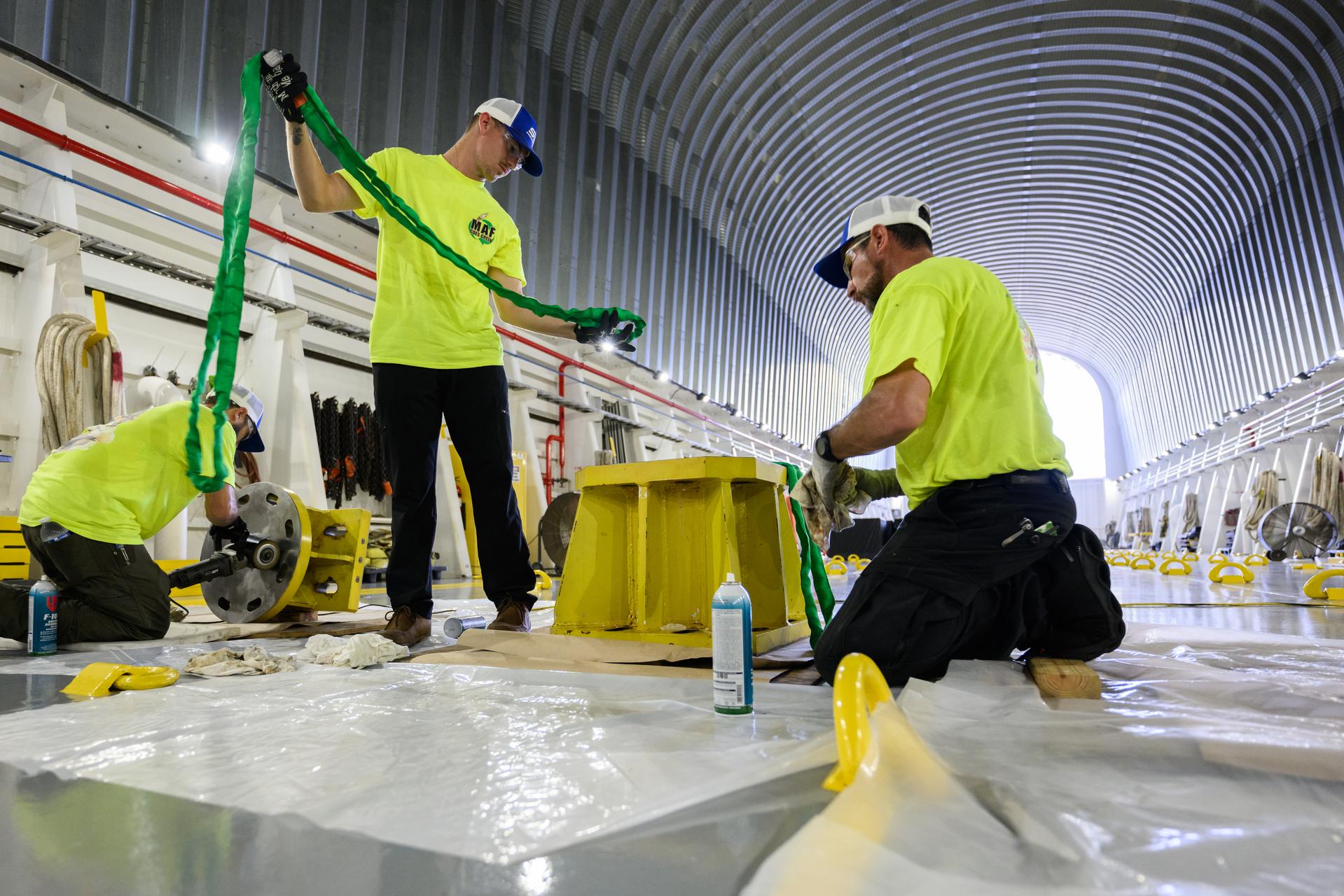 These photos show how team members installed pedestals aboard NASA’s Pegasus barge to hold and secure the massive core stage of NASA’s SLS (Space Launch System) rocket, indicating the barge and its crew are nearly ready for the barge’s first delivery to support the Artemis II test flight around the Moon. The barge will ferry the fully assembled core stage on a 900-mile journey from the agency’s Michoud Assembly Facility in New Orleans to its Kennedy Space Center in Florida. The Pegasus crew began installing the pedestals July 10. Pegasus is maintained at NASA Michoud. The SLS core stage is fully manufactured at Michoud. NASA is working to land the first woman, first person of color, and its first international partner astronaut on the Moon under Artemis. SLS is part of NASA’s backbone for deep space exploration, along with the Orion spacecraft, supporting ground systems, advanced spacesuits and rovers, the Gateway in orbit around the Moon, and commercial human landing systems. SLS is the only rocket that can send Orion, astronauts, and supplies to the Moon in a single launch. 
