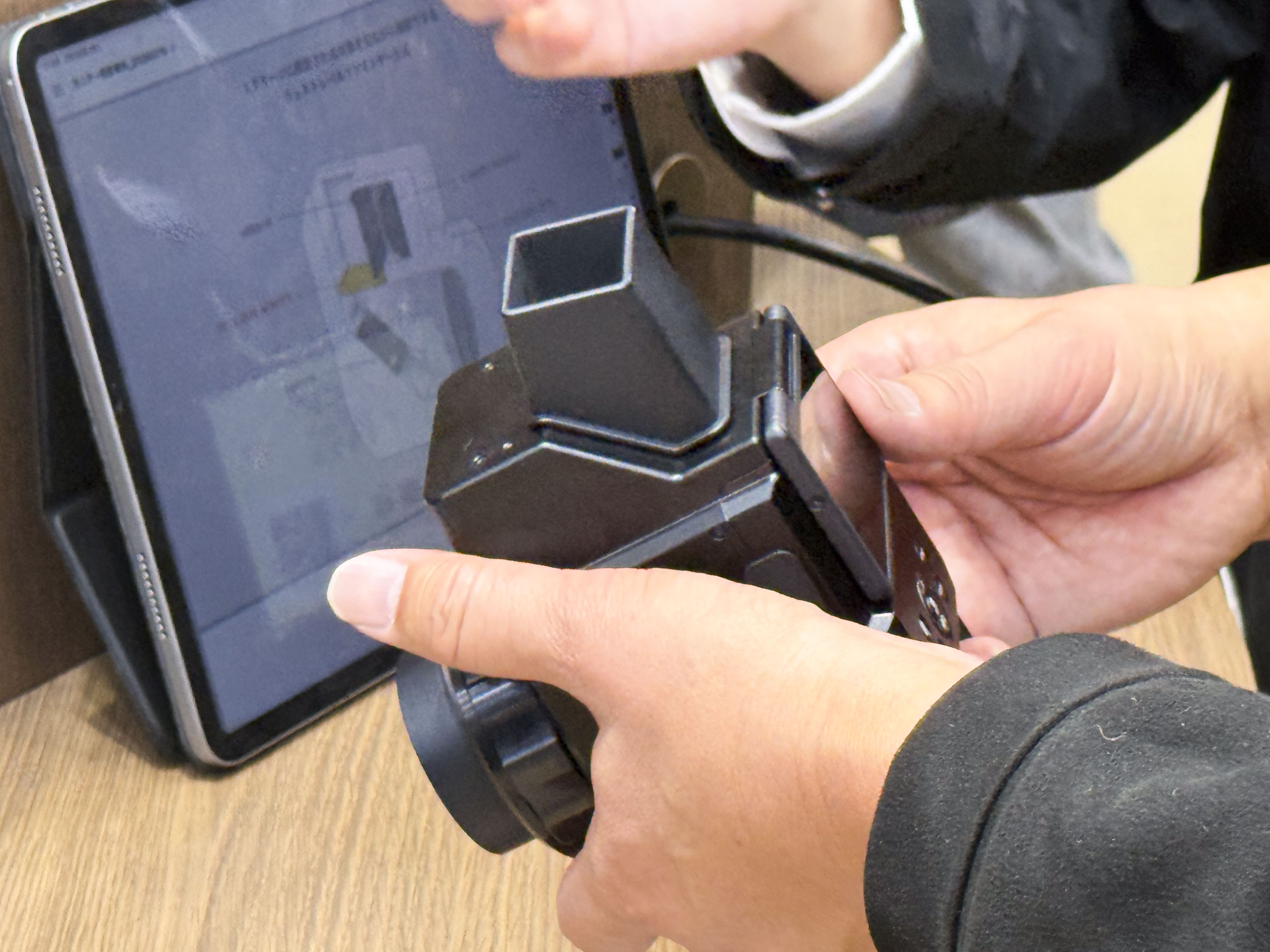 Canon's Analog Concept Camera in users hand at the Canon booth at the CP+ 2026 show